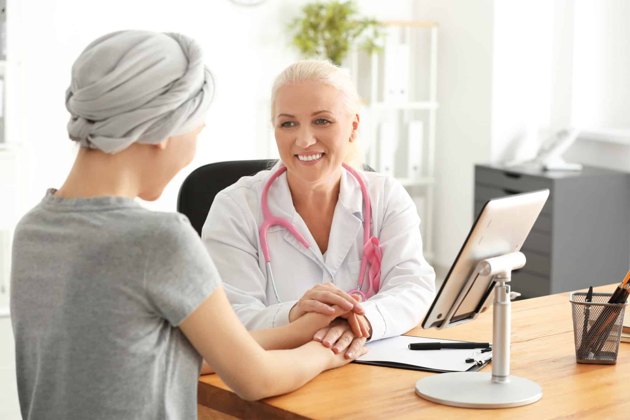 MammogramvsBreastUltrasound Radiographer sitting with breast cancer patient in Doctor’s rooms